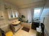 Schicke Eigentumswohnung zur Selbstnutzung mit einer ca. 15 m² großen Dachterrasse - Badezimmer