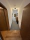 Geräumige 5-Zimmer-Wohnung mit zwei Bädern in Herne - Langer Flur mit Holztüren.jpg