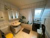 Schicke Eigentumswohnung zur Selbstnutzung mit einer ca. 30 m² großen Dachterrasse - Badezimmer.jpg