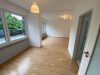 Schicke Eigentumswohnung zur Selbstnutzung mit einer ca. 30 m² großen Dachterrasse - Wohnzimmer.jpg