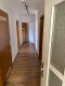 Altbau-Dachgeschosswohnung mit 4 Zimmern und 103 m² in Witten - Langer Flur mit Holztüren.jpg