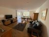 Hochwertige 2-Zimmer-Wohnung mit Balkon und Tiefgaragenstellplatz in Selm - Wohnzimmer Richtung Balkon.jpg